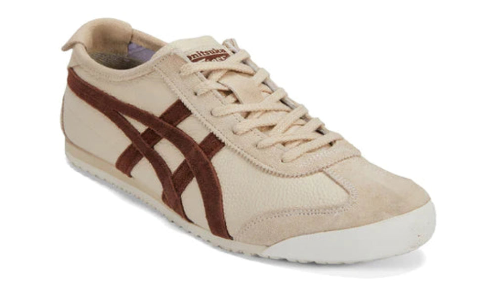 Beige and brown sneaker with Onitsuka Tiger logo on a white background