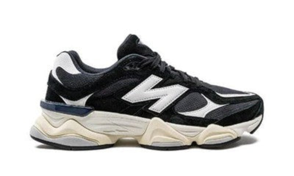 Black and white sneaker with a brand logo on a white background