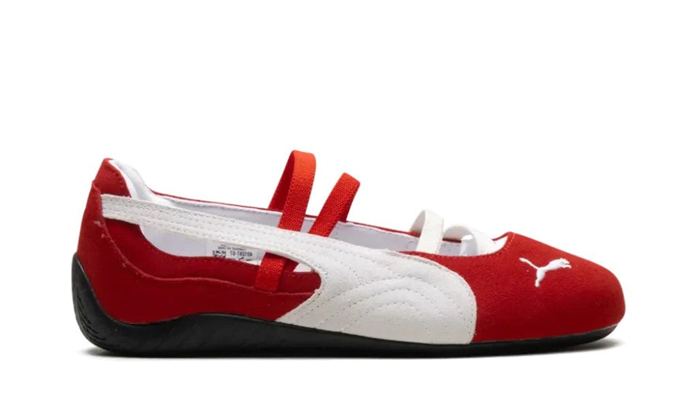 Red and white shoe with a visible brand logo on a white background