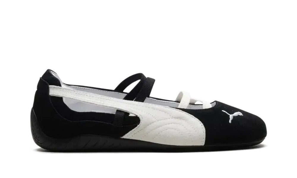 Black and white shoe with a visible brand logo on a white background