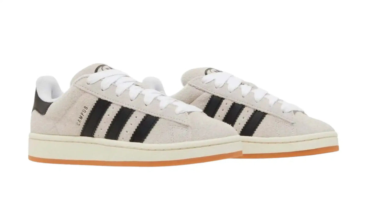 Adidas Campus cream black unisex sneakers with black stripes and gum sole, front angled pair view