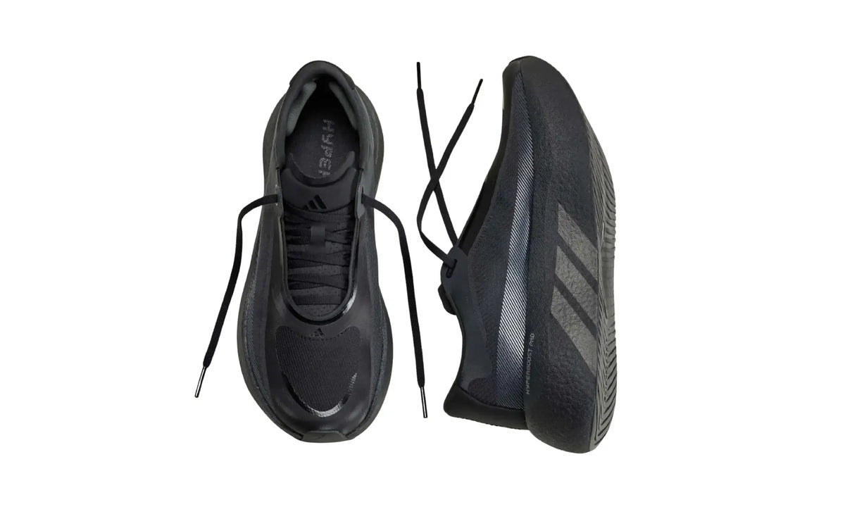 Side profile of black Adidas HYPERBOOST EDGE running shoe