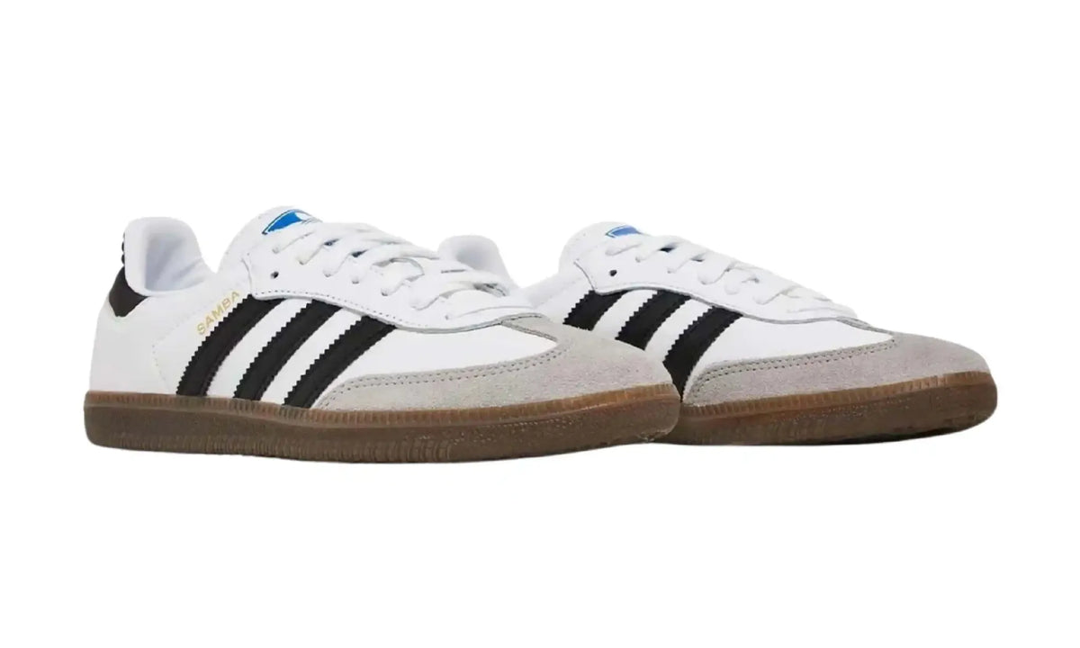 Adidas Samba OG white black unisex sneakers with black stripes and dark gum sole, front angled pair view