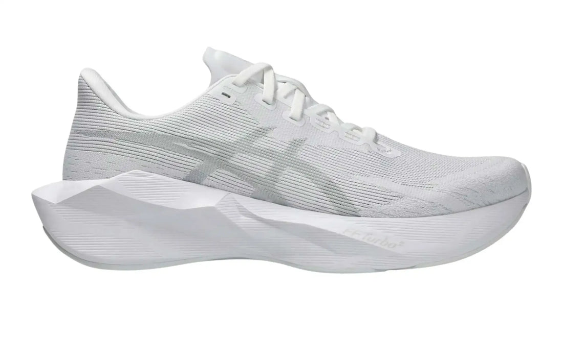 ASICS NOVABLAST 6 White/White sneaker, side view showing tonal branding and sculpted white sole