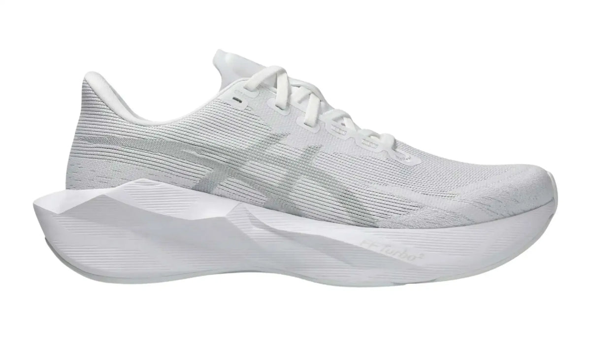 ASICS NOVABLAST 6 White/White sneaker, side view showing tonal branding and sculpted white sole