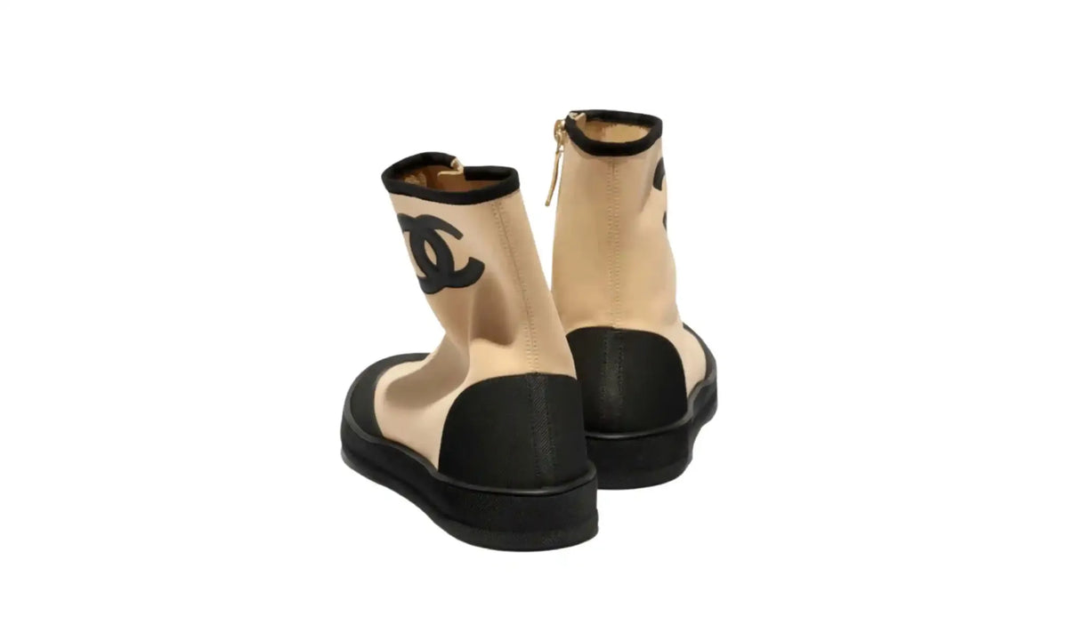 Chanel Beige Black Short Boots for Women rear pair view showing zip closures, black heel overlays, top trim and black soles