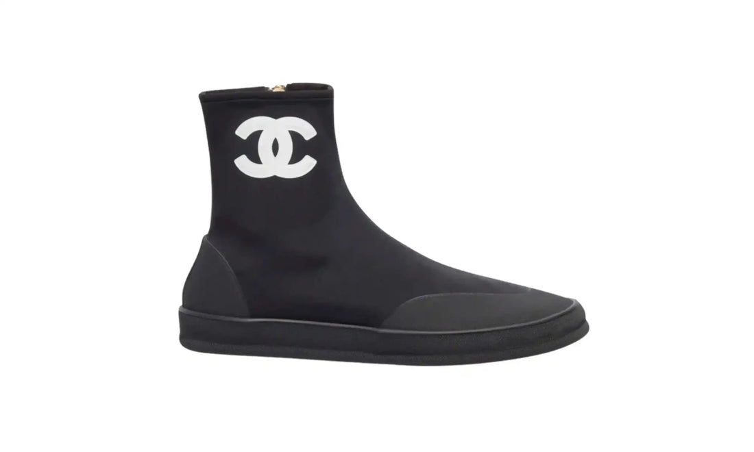 Chanel Black White Short Boots for Women, side view showing white CC logo, rounded toe, tonal toe and heel overlays and black sole