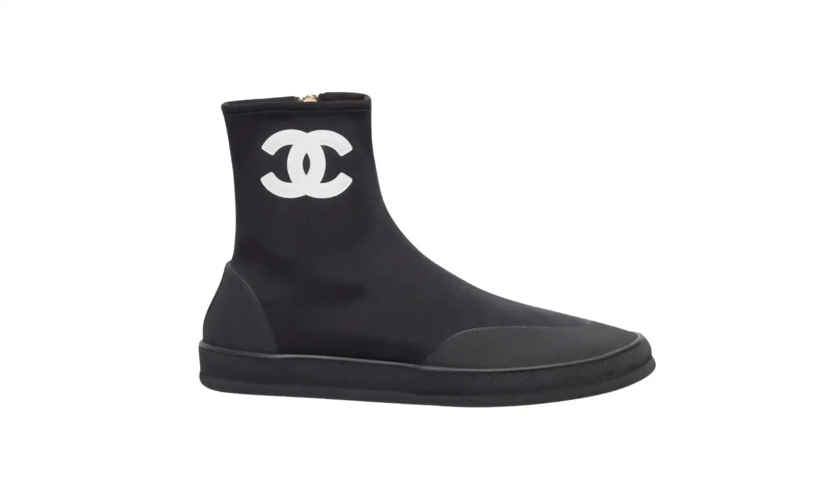 Chanel Black White Short Boots for Women, side view showing white CC logo, rounded toe, tonal toe and heel overlays and black sole