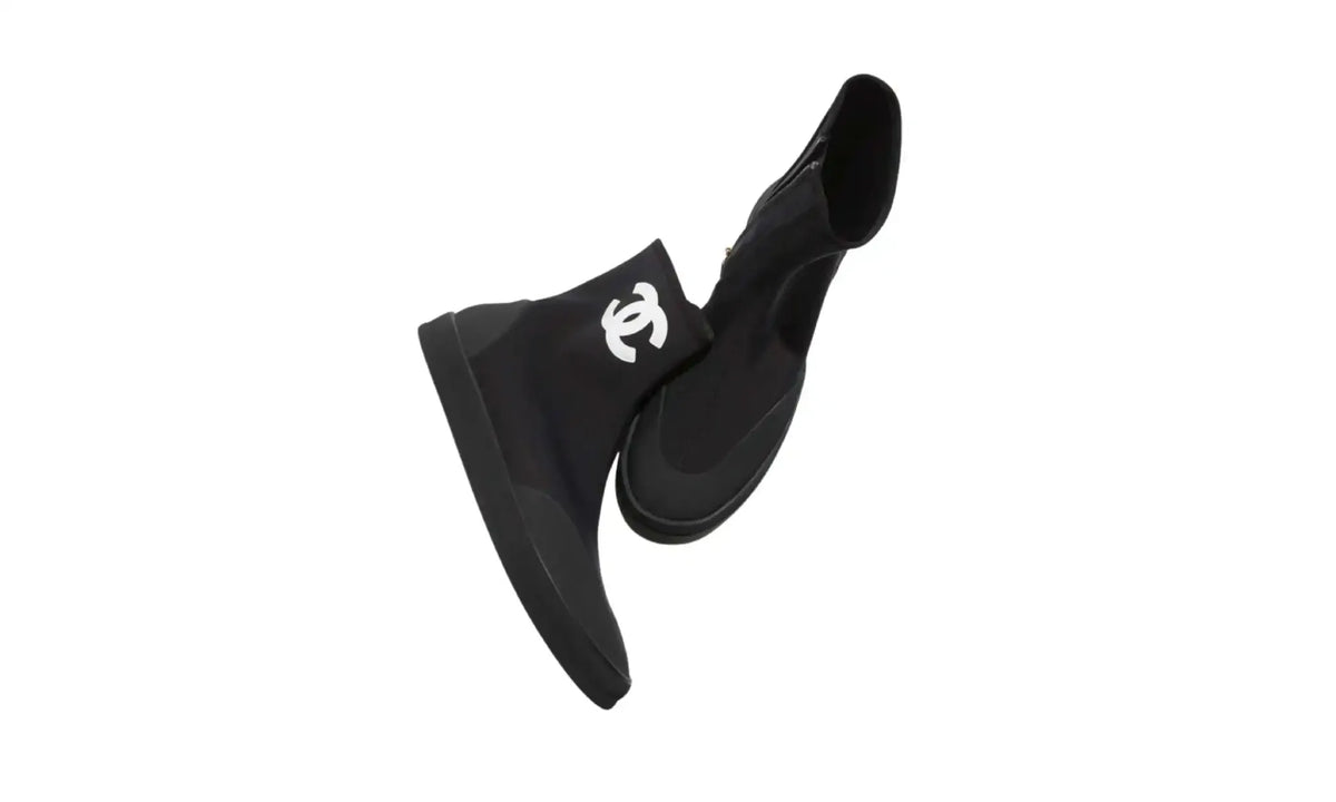 Chanel Black White Short Boots for Women, angled pair view showing short shafts, rounded toes and white CC logo