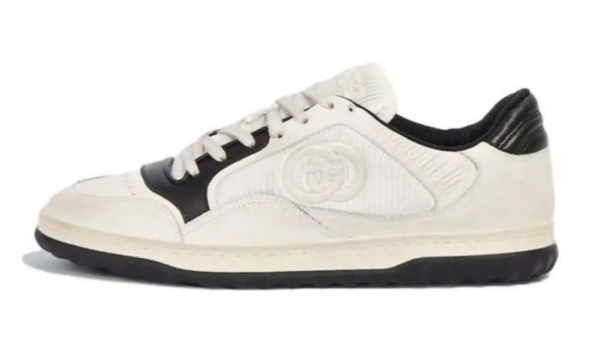Opposite side view of Gucci GG ivory and black low-top sneakers