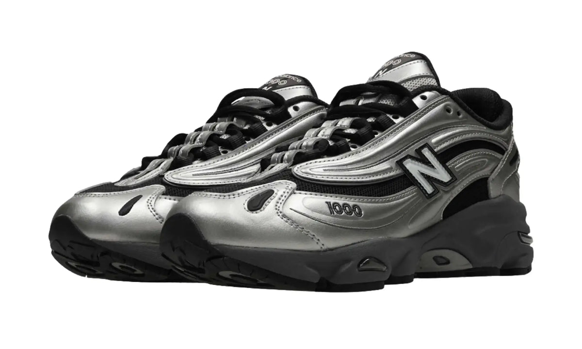 Pair of New Balance 1000 Black Metallic Silver unisex sneakers, angled front view