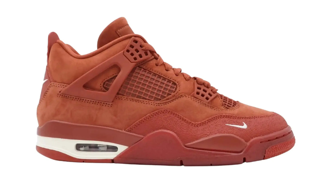 Side view of Nigel Sylvester Air Jordan 4 Brick by Brick sneakers in orange with Sail midsole accents