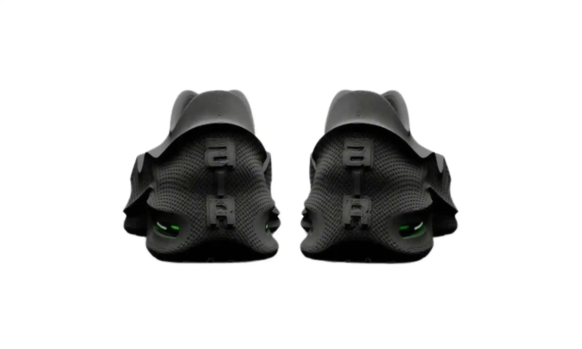 Nike Air Max 1000 Black men’s slip-on sneakers, rear view showing textured heels and neon-green heel windows