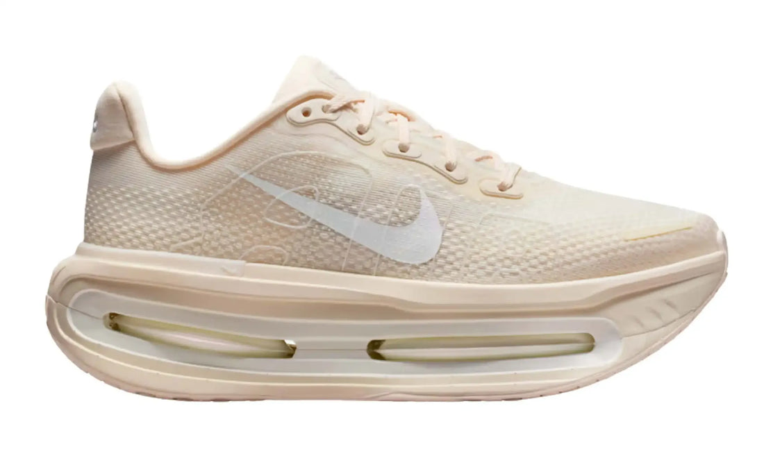 Nike Vomero Premium Chalk sneaker in cream and white, side view with sculpted high-stack sole