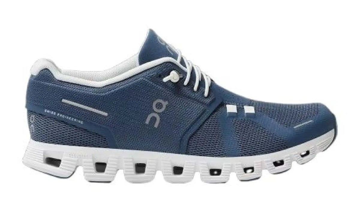 On Cloud 5 Denim/White sneaker, side view showing a blue upper, white laces and white open-section sole