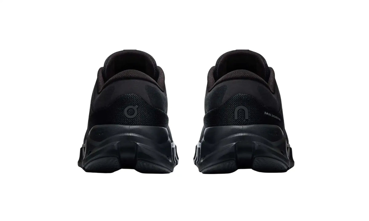 On Cloud X 5 Black unisex shoes, rear view showing tonal On heel logos and sculpted dark soles
