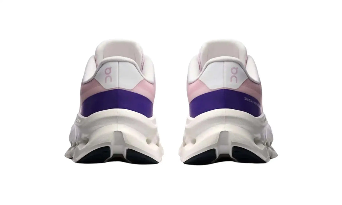 On Cloudtilt Remix women’s sneakers in pink, lilac and ivory, rear view showing purple heel accents, On logos and ivory soles