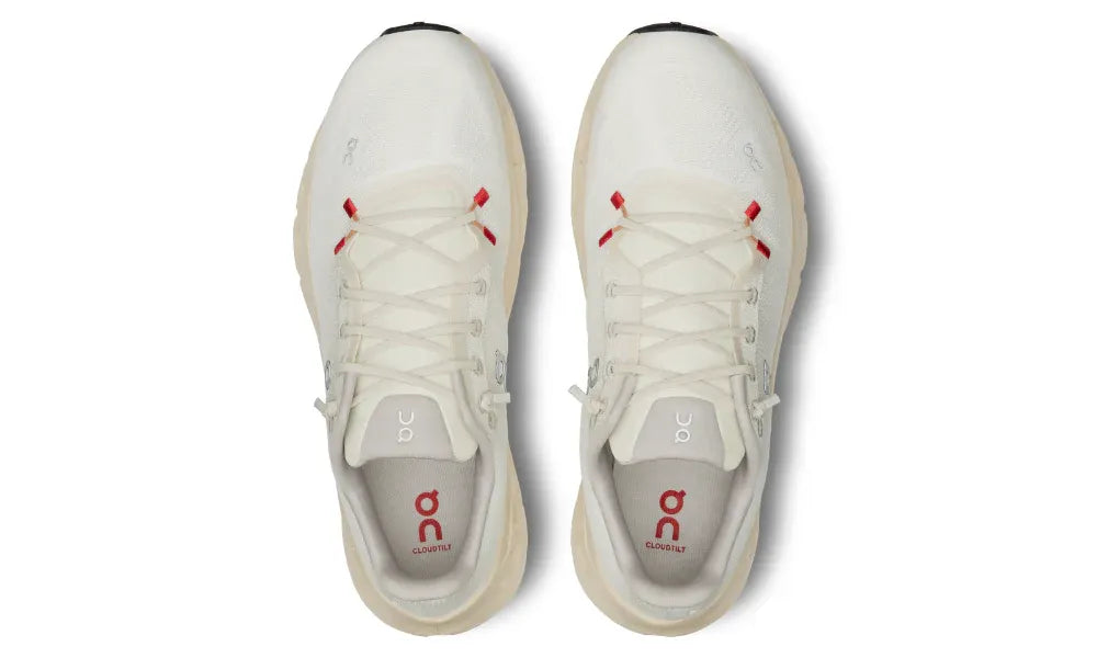 White sneakers with red accents on a white background