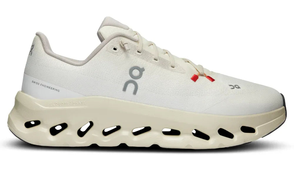 White athletic shoe with unique sole design on a white background