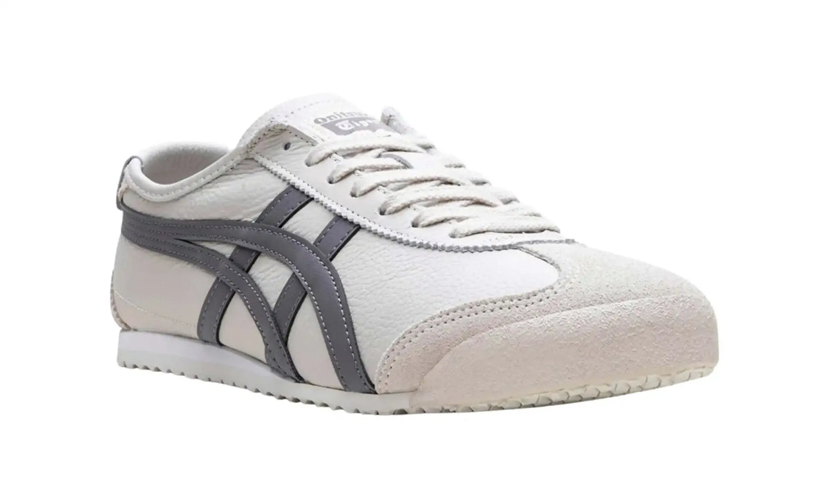 Onitsuka Tiger Mexico 66 Grey White unisex sneaker, angled front view showing laces and toe overlays