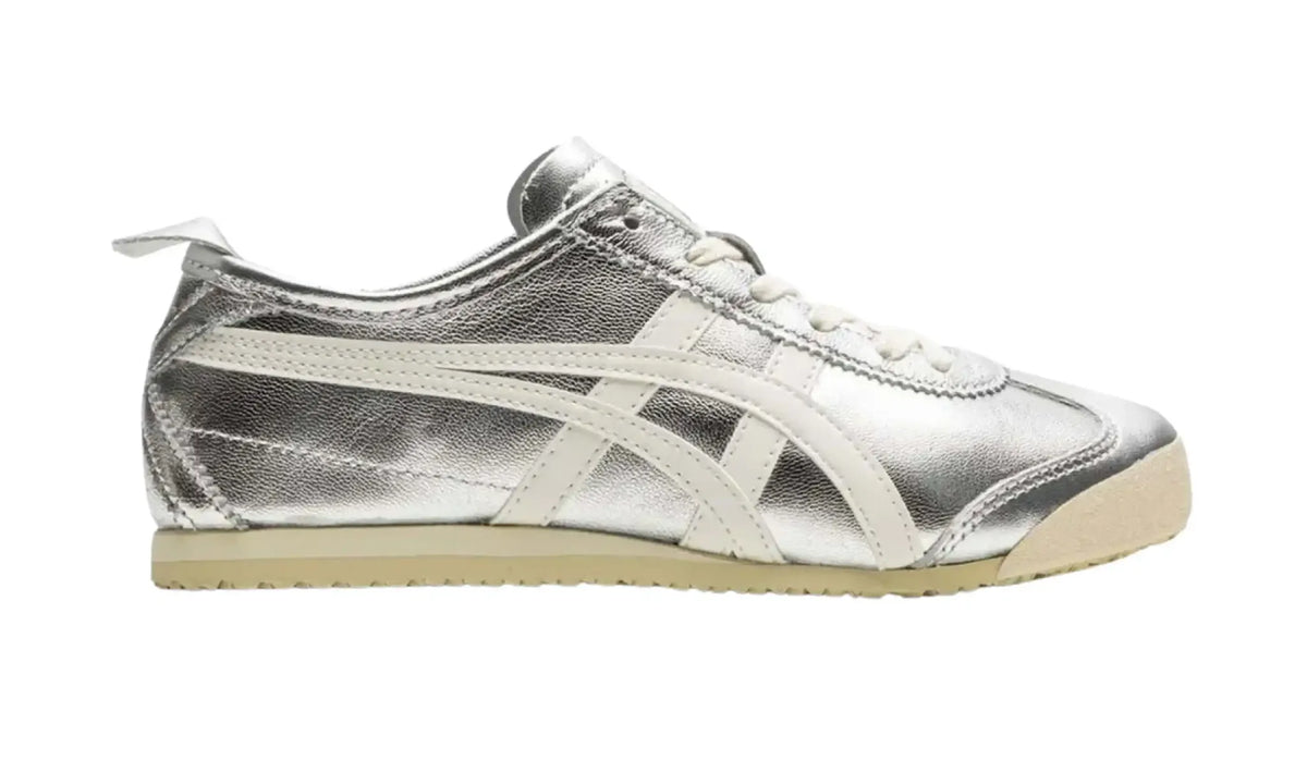 Onitsuka Tiger Mexico 66 unisex sneaker with a metallic silver upper, off-white side stripes and laces, a heel tab and a cream-coloured sole
